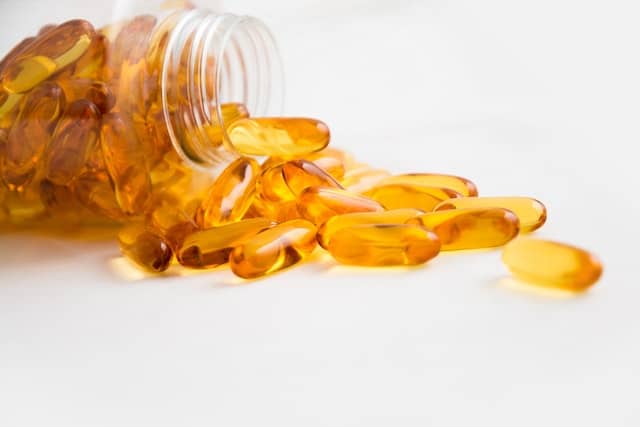 CBD capsules close up on a clean tabletop.